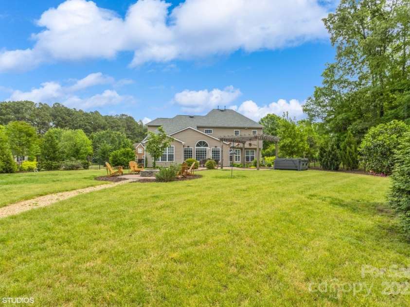 10012 Royal Colony Drive, Waxhaw, NC 28173.  MLS# CAR4250222, YatesRealty ID 8489. Large level backyard