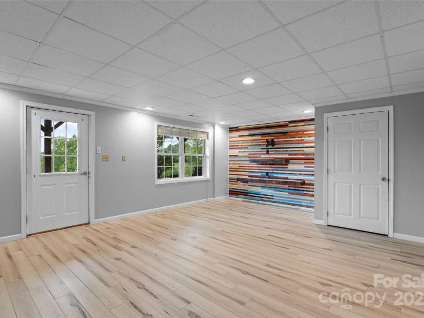 271 Breton Ridge Road, Leicester, NC 28748.  MLS# CAR4284121, YatesRealty ID 8497. Lower Level Flex Space/Living Area
