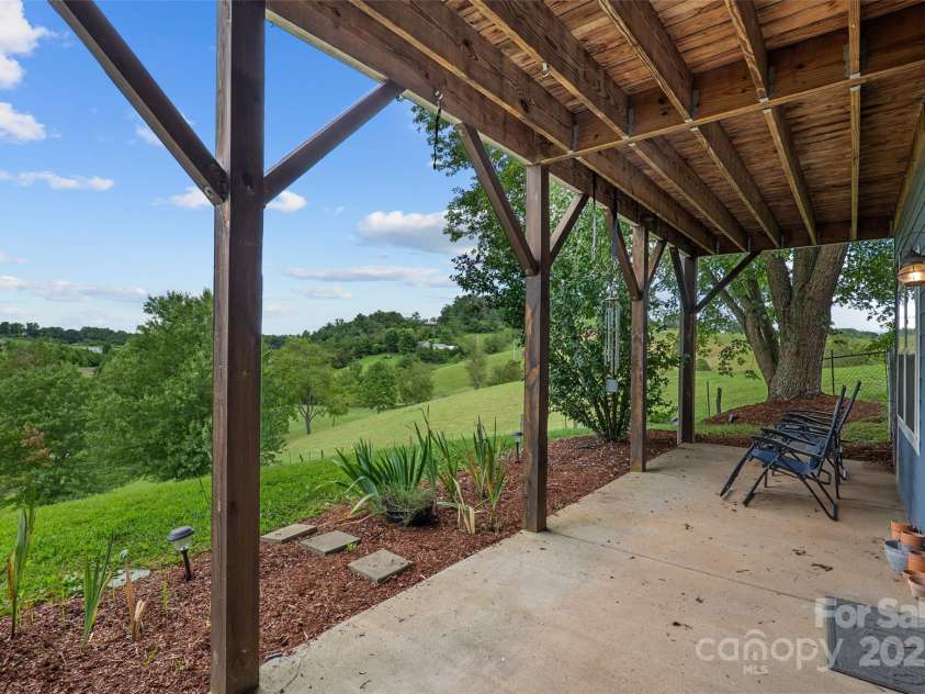 271 Breton Ridge Road, Leicester, NC 28748.  MLS# CAR4284121, YatesRealty ID 8497. Lower Level Patio with Mountain Views
