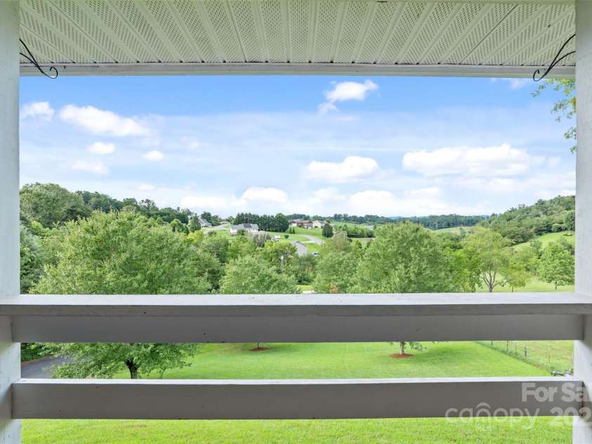 271 Breton Ridge Road, Leicester, NC 28748.  MLS# CAR4284121, YatesRealty ID 8497. Upper Level Porch Views