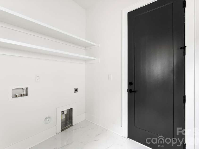 2025 South Street, Charlotte, NC 28208.  MLS# CAR4345630, YatesRealty ID 8502. Large laundry room on main level