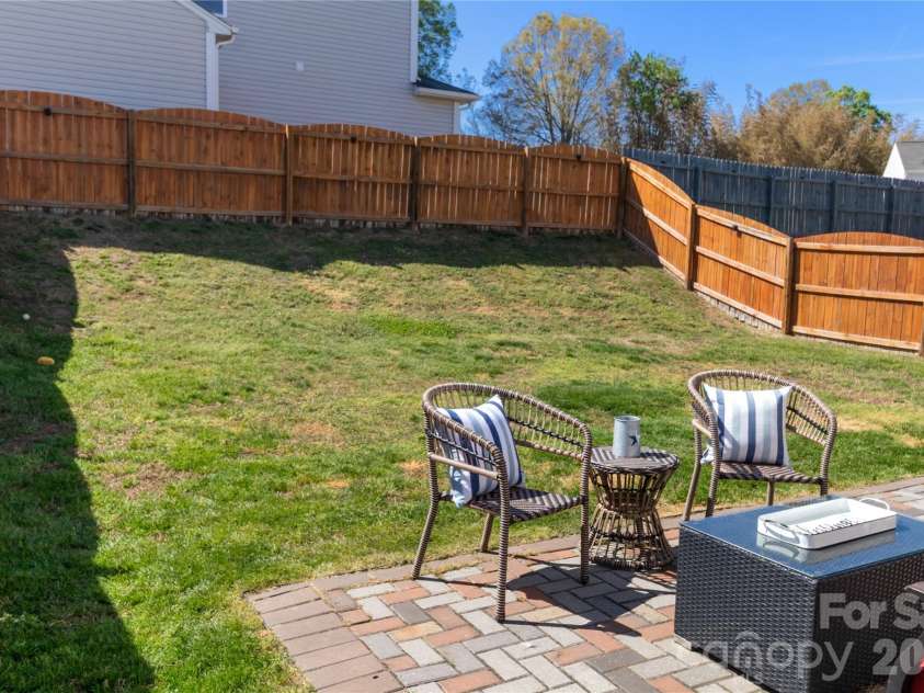 905 Alta Way, Kannapolis, NC 28081.  MLS# CAR4360653, YatesRealty ID 8515. Sloped rear portion of the backyard. 