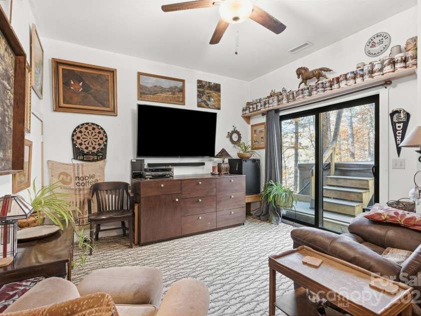 123 Holly Hill Farm Road, Mars Hill, NC 28754.  MLS# CAR4321116, YatesRealty ID 852. Downstairs TV Room or Bedroom with Stairs to the Hot Tub! 