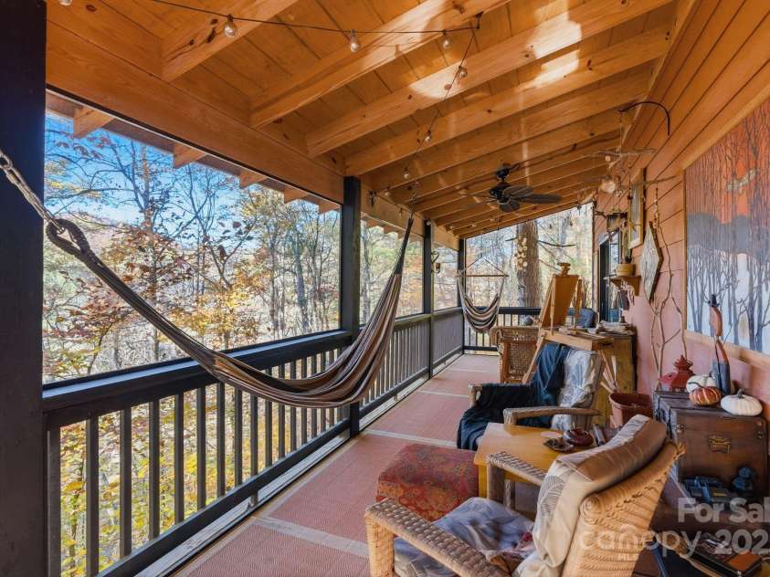 123 Holly Hill Farm Road, Mars Hill, NC 28754.  MLS# CAR4321116, YatesRealty ID 852. Sunny Screened Deck over the Woods