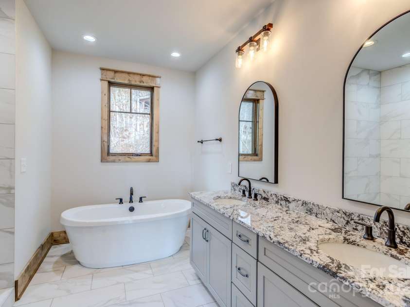 37 Tioga Trail, Banner Elk, NC 28604.  MLS# CAR4215738, YatesRealty ID 852. Primary bathroom with double vanity and large tub