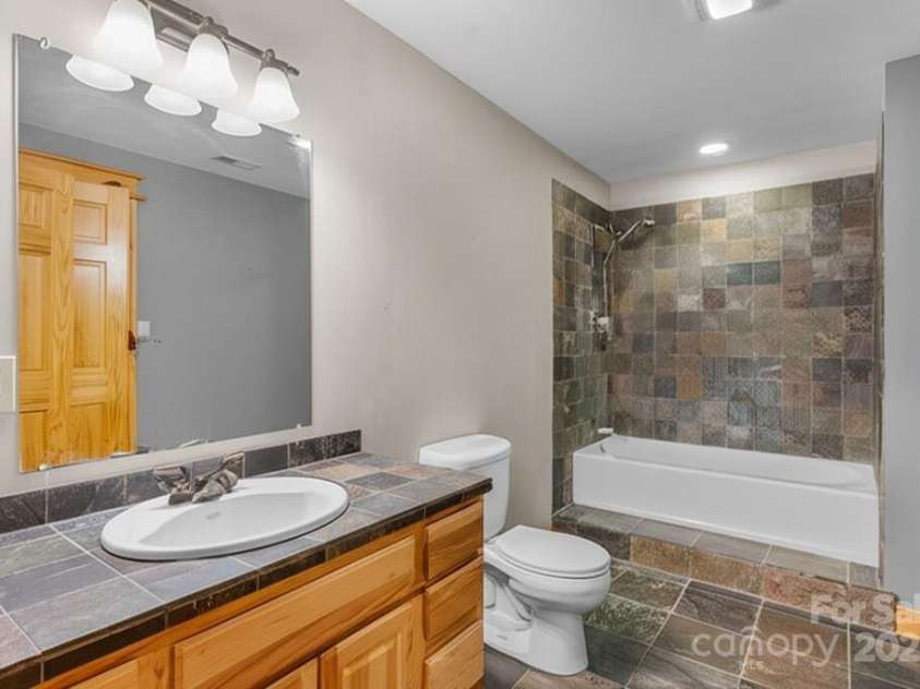 32 Indian Knob Road, Asheville, NC 28803.  MLS# CAR4246134, YatesRealty ID 8521. Lower bath