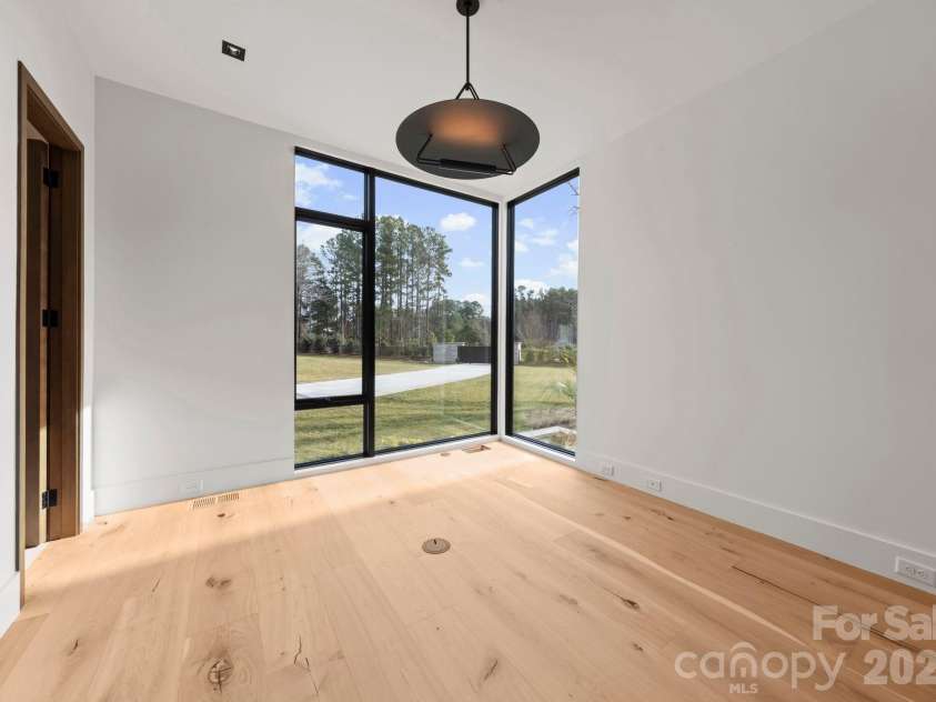 2536 Brawley School Road, Mooresville, NC 28117.  MLS# CAR4340912, YatesRealty ID 8523. Main-level office or additional bedroom.
