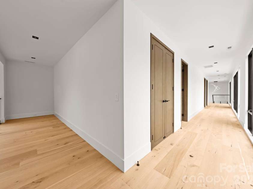 2536 Brawley School Road, Mooresville, NC 28117.  MLS# CAR4340912, YatesRealty ID 8523. Upper-level hallway.