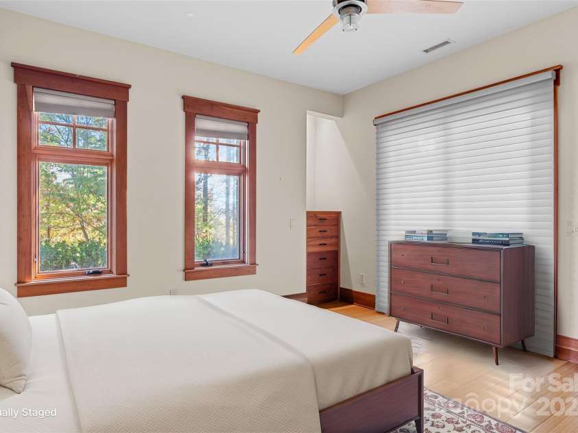 150 Cherry Hill, Mill Spring, NC 28756.  MLS# CAR4201746, YatesRealty ID 8524. Lower level bedroom has two French doors out to a private sitting area, a large walk in closet and full bath.