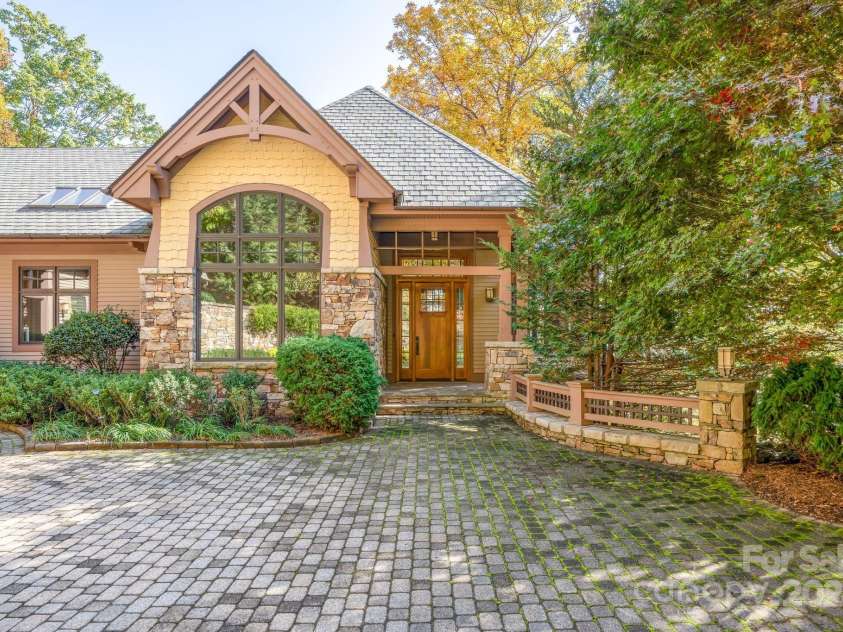 150 Cherry Hill, Mill Spring, NC 28756.  MLS# CAR4201746, YatesRealty ID 8524. Main entrance is one of two covered entryways, or you can enter the home from the garage.