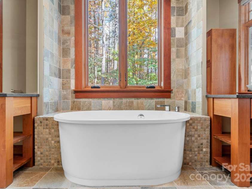 150 Cherry Hill, Mill Spring, NC 28756.  MLS# CAR4201746, YatesRealty ID 8524. No curtains needed with the privacy and views this lot affords. You will love this extra deep Japanese soaking tub!