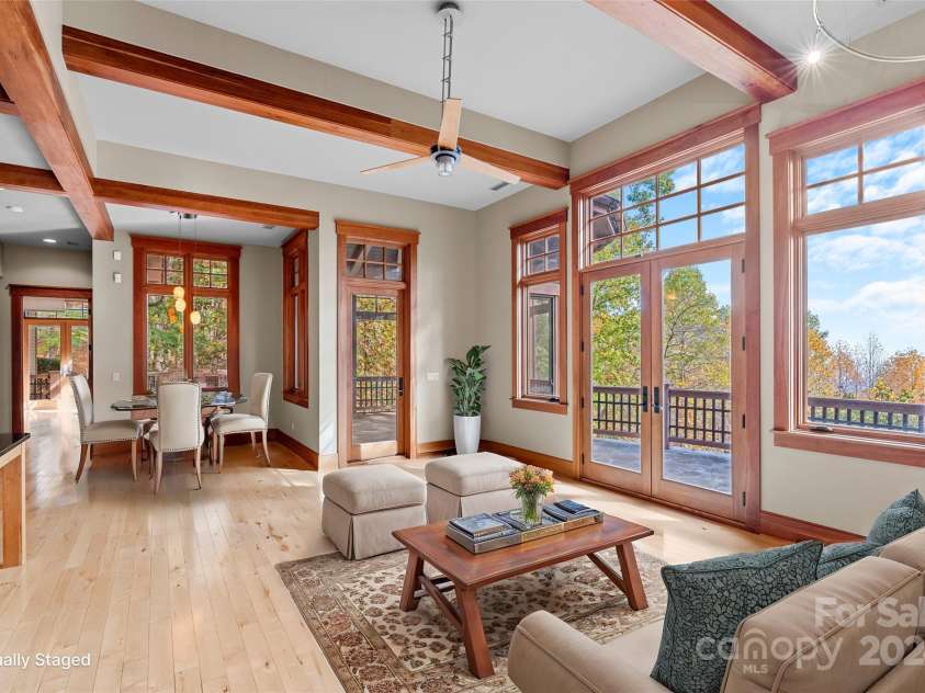 150 Cherry Hill, Mill Spring, NC 28756.  MLS# CAR4201746, YatesRealty ID 8524. Open concept kitchen area includes a breakfast nook and a casual seating area that opens out to a screened porch and the open deck behind the house. Long range views from this room are gorgeous!