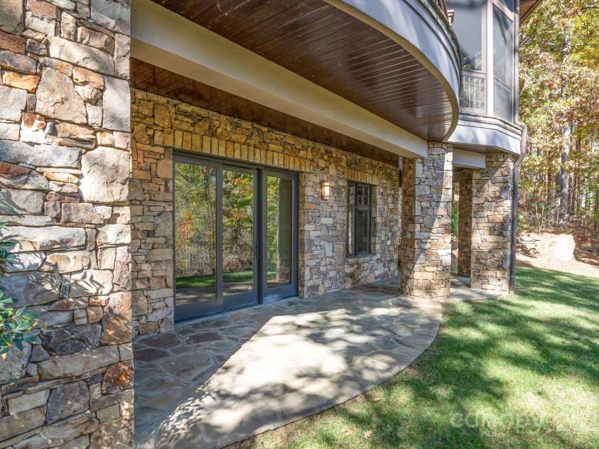 150 Cherry Hill, Mill Spring, NC 28756.  MLS# CAR4201746, YatesRealty ID 8524. Outdoor access from the lower level den could be a great spot for patio furniture or outside dining.