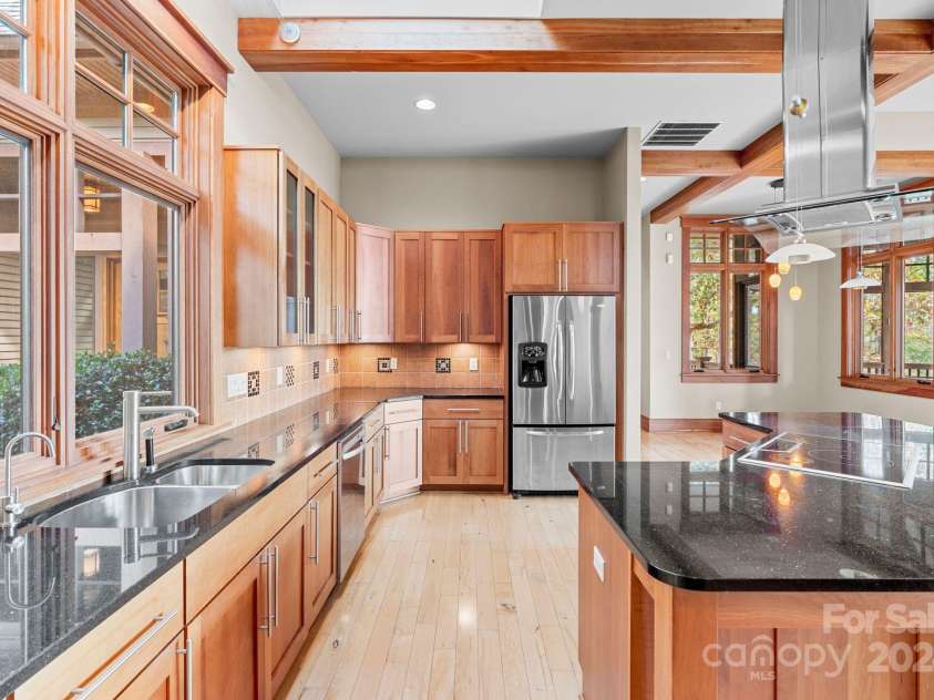 150 Cherry Hill, Mill Spring, NC 28756.  MLS# CAR4201746, YatesRealty ID 8524. So much counter space! Every aspect of this home is top quality and custom. Floors are solid maple.