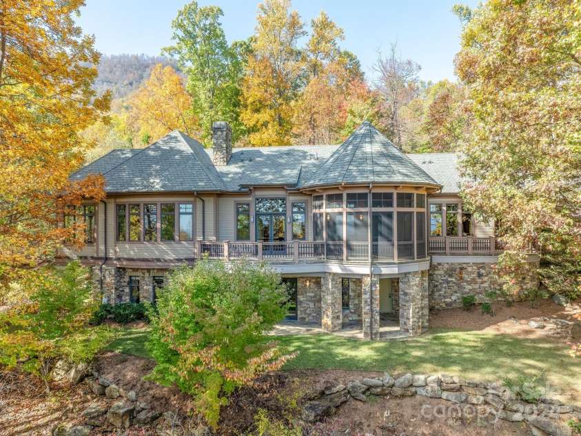 150 Cherry Hill, Mill Spring, NC 28756.  MLS# CAR4201746, YatesRealty ID 8524. This Brights Creek gem was designed to maximize the gorgeous mountain views with beautiful craftsmanship and quality stonework.  Built for entertaining, relaxing, and enjoying the natural surroundings.