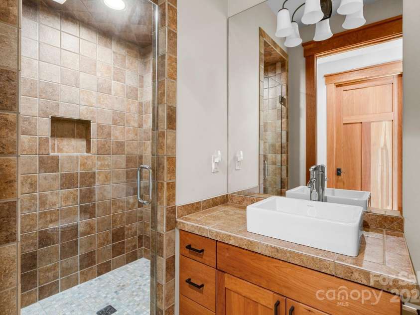 150 Cherry Hill, Mill Spring, NC 28756.  MLS# CAR4201746, YatesRealty ID 8524. Upper level guest suite includes a private full bath.