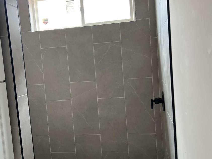 140 First Street, Huntersville, NC 28078.  MLS# CAR4227791, YatesRealty ID 8536. Primary bath shower with ceramic tile floor