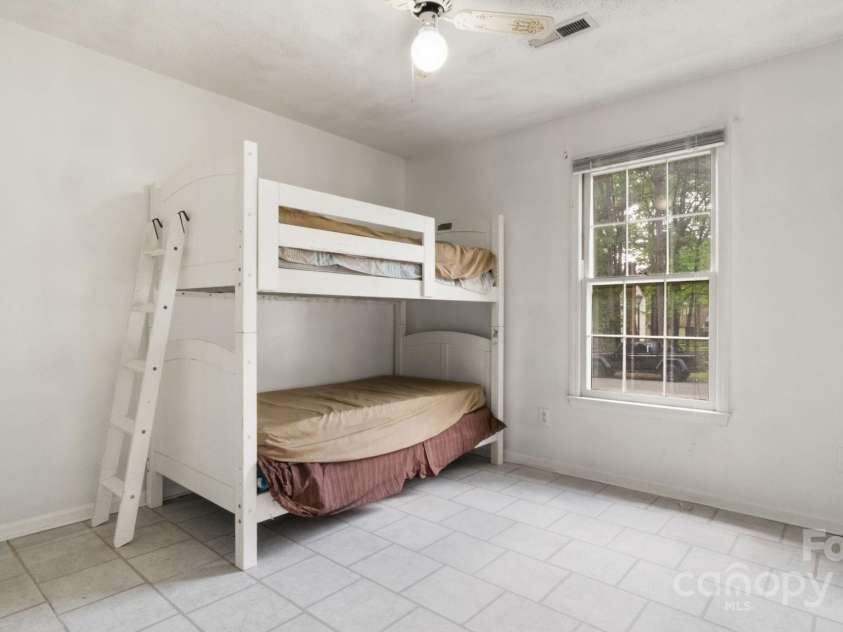 6915 Norchester Court, Charlotte, NC 28227.  MLS# CAR4250063, YatesRealty ID 8539. 2nd bedroom has vinyl flooring