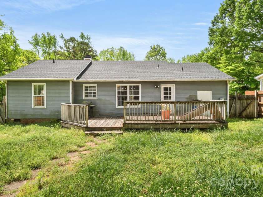 6915 Norchester Court, Charlotte, NC 28227.  MLS# CAR4250063, YatesRealty ID 8539. Backyard with huge deck!