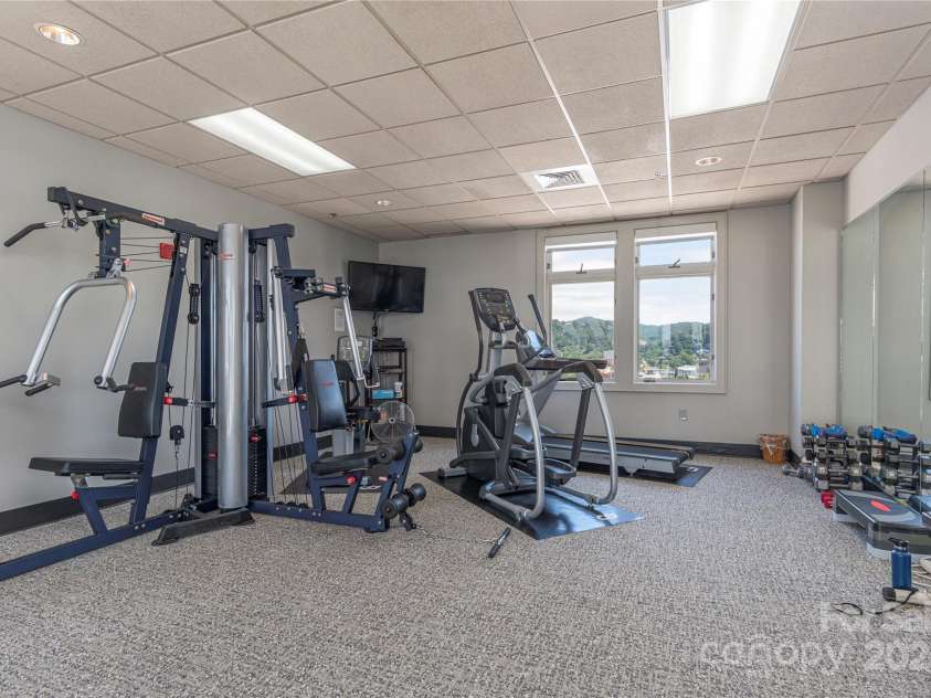 21 Battery Park Avenue, Asheville, NC 28801.  MLS# CAR4317876, YatesRealty ID 8540. Workout room on Penthouse level