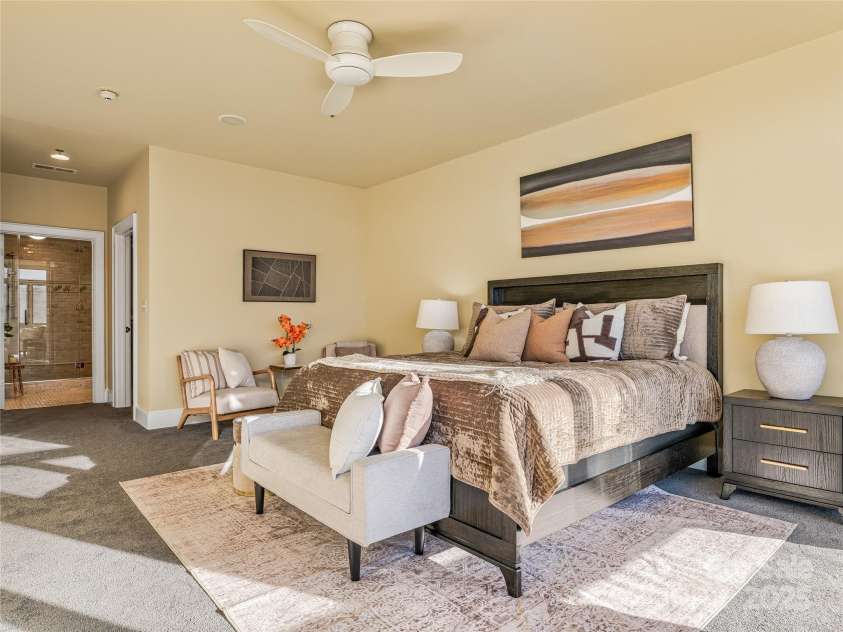 21 Battery Park Avenue, Asheville, NC 28801.  MLS# CAR4322706, YatesRealty ID 8540. Primary suite with walk-in closet and primary bathroom