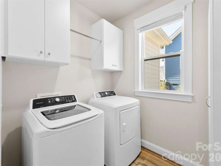 4117 Spring Cove Way, Belmont, NC 28012.  MLS# CAR4360370, YatesRealty ID 8545. Main Level Laundry room with built in cabinetry.