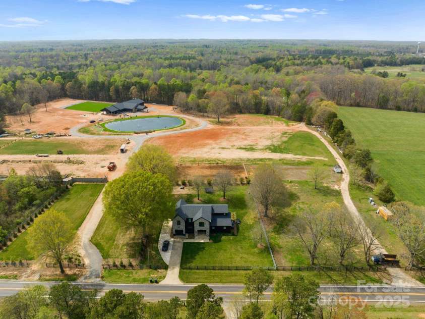 1565 Shinnville Road, Cleveland, NC 27013.  MLS# CAR4215250, YatesRealty ID 855. Aerial view of 60 plus acres with multiple driveway entrances
