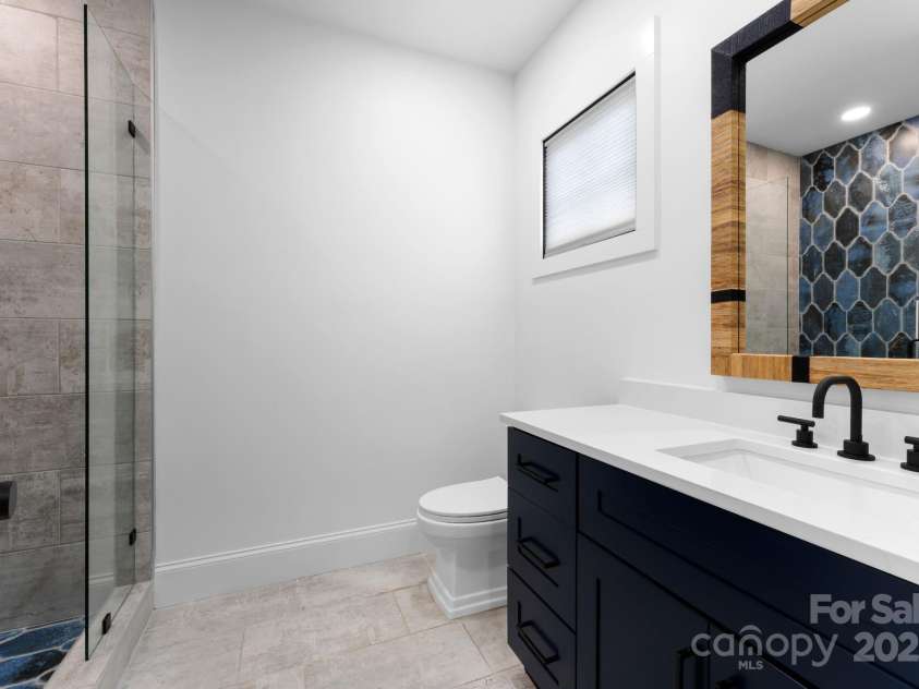 1565 Shinnville Road, Cleveland, NC 27013.  MLS# CAR4215250, YatesRealty ID 855. Upper level guest bathroom 
