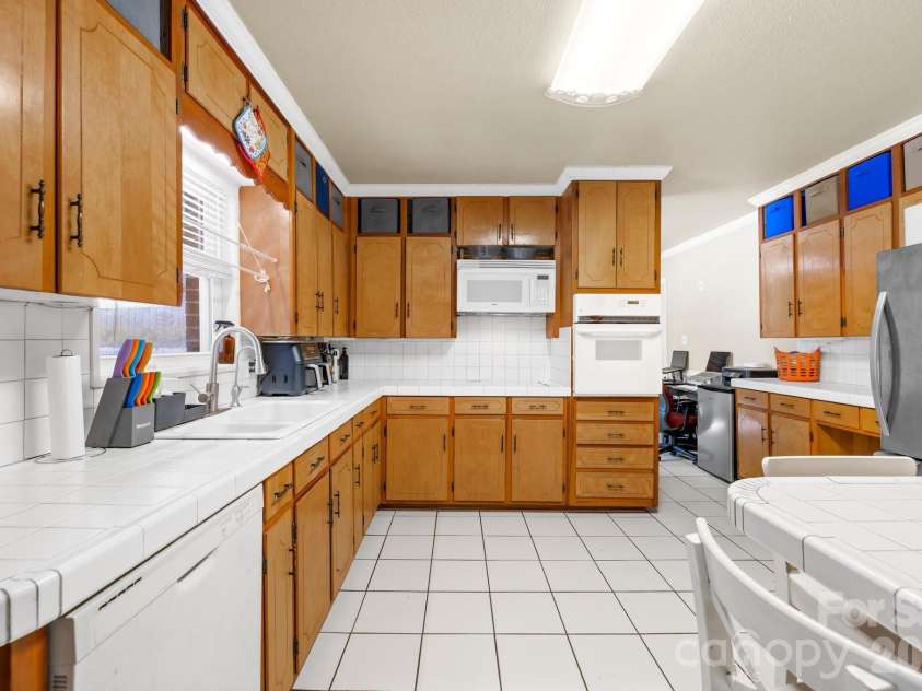 6711 Old Mocksville Road, Salisbury, NC 28144.  MLS# CAR4343686, YatesRealty ID 8553. Main house kitchen