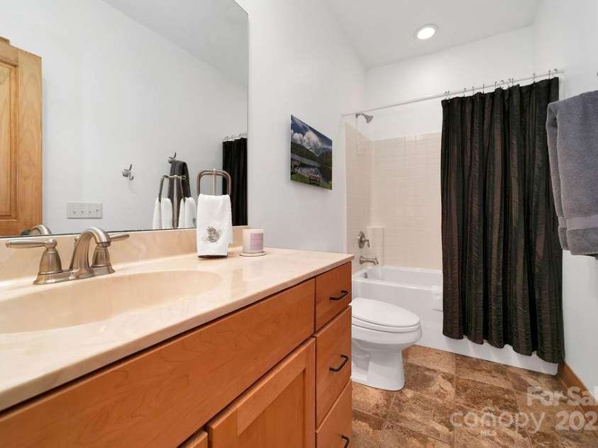 43 Adelv Court, Brevard, NC 28712.  MLS# CAR4248792, YatesRealty ID 8556. Full Bath seperates the 2nd and 3rd bedrooms