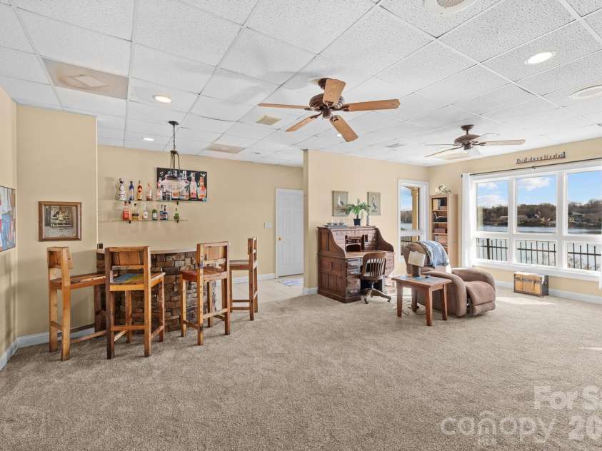 121 Pleasant Pointe Drive, Hickory, NC 28601.  MLS# CAR4327566, YatesRealty ID 8557. Finished basement entertainment space.