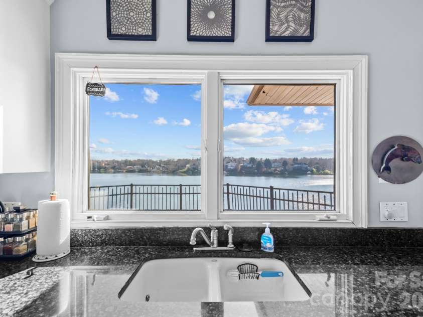 121 Pleasant Pointe Drive, Hickory, NC 28601.  MLS# CAR4327566, YatesRealty ID 8557. Lake view from kitchen looking out onto your spacious balcony.