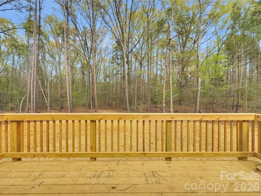2504 Lazy Oak Drive, Lancaster, SC 29720.  MLS# CAR4357902, YatesRealty ID 8558. Large deck overlooking wooded back yard