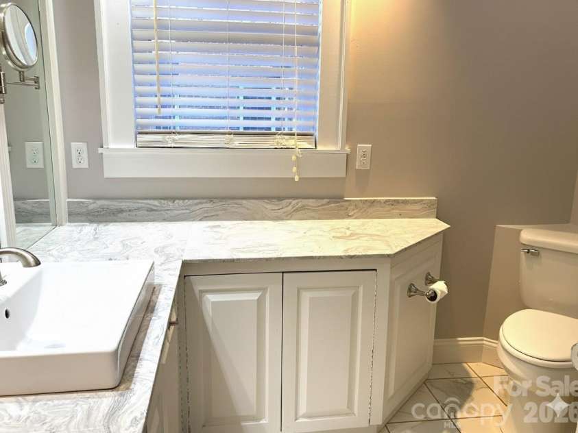 1051 Pee Dee Avenue, Albemarle, NC 28001.  MLS# CAR4328928, YatesRealty ID 8560. Main level hall full bath.