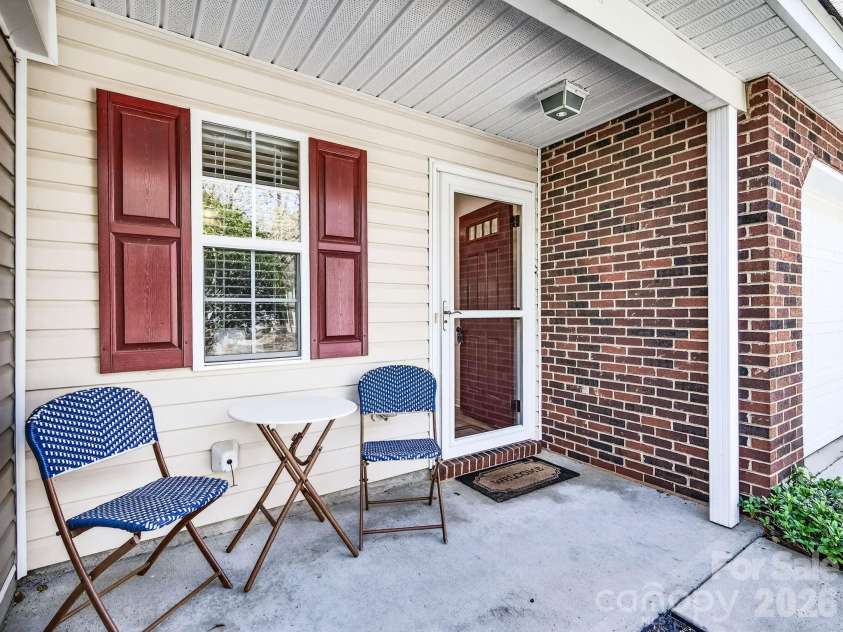 9977 Reindeer Way Lane, Charlotte, NC 28216.  MLS# CAR4351235, YatesRealty ID 8564. Covered Front Porch 