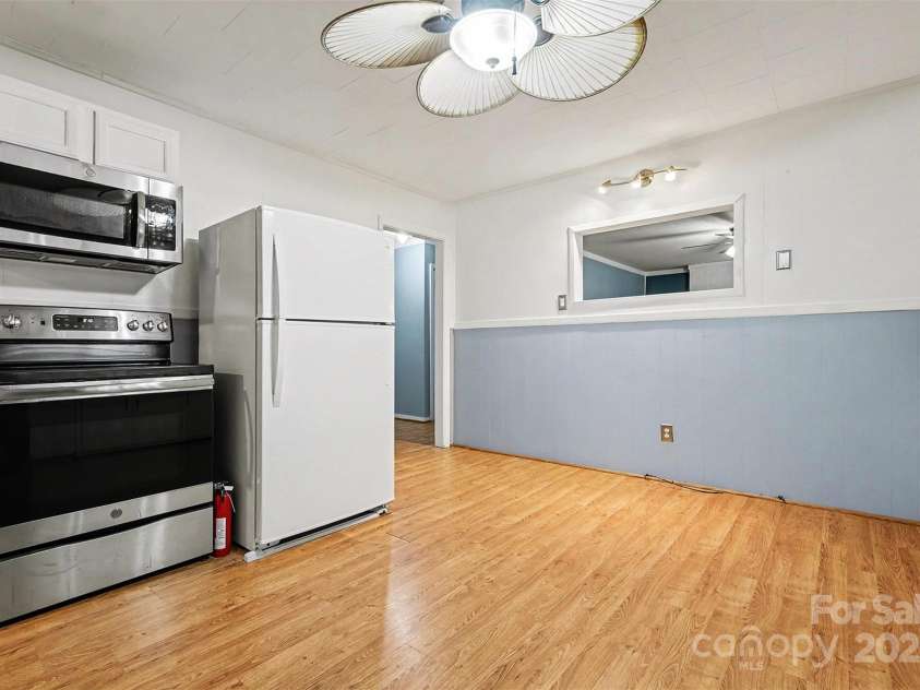 119 Moore Drive, Gastonia, NC 28056.  MLS# CAR4332115, YatesRealty ID 8565. The durable flooring in the kitchen adds warmth and functionality, and the open layout allows for easy movement and flexibility. Perfect for casual dining or gathering with guests.