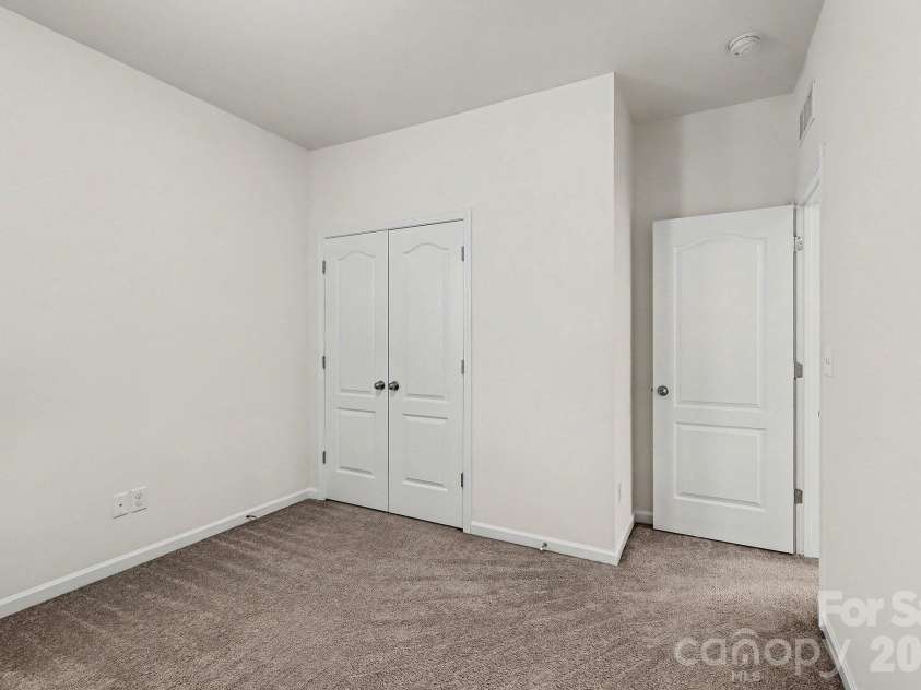 6056 Cloverdale Drive, Tega Cay, SC 29708.  MLS# CAR4337885, YatesRealty ID 8573. Bedroom #4 features neutral paint and carpet