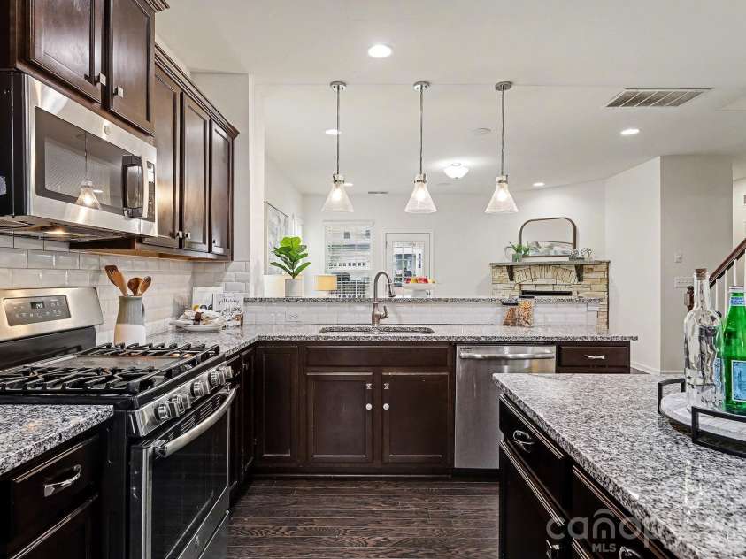 6056 Cloverdale Drive, Tega Cay, SC 29708.  MLS# CAR4337885, YatesRealty ID 8573. Breakfast bar seats 3+