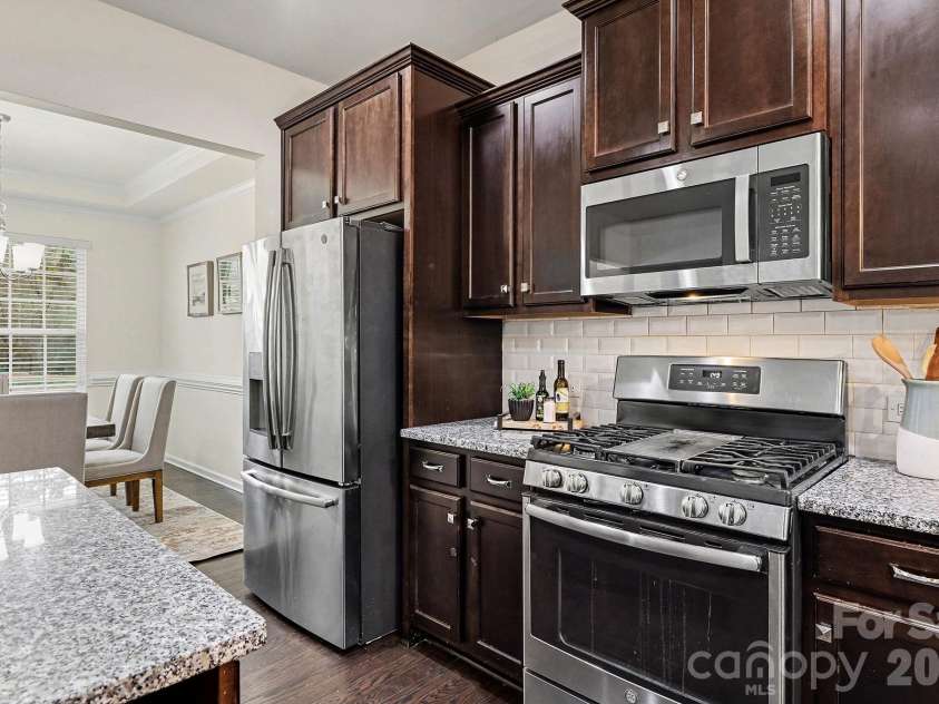 6056 Cloverdale Drive, Tega Cay, SC 29708.  MLS# CAR4337885, YatesRealty ID 8573. Direct access to the formal dining room from the kitchen
