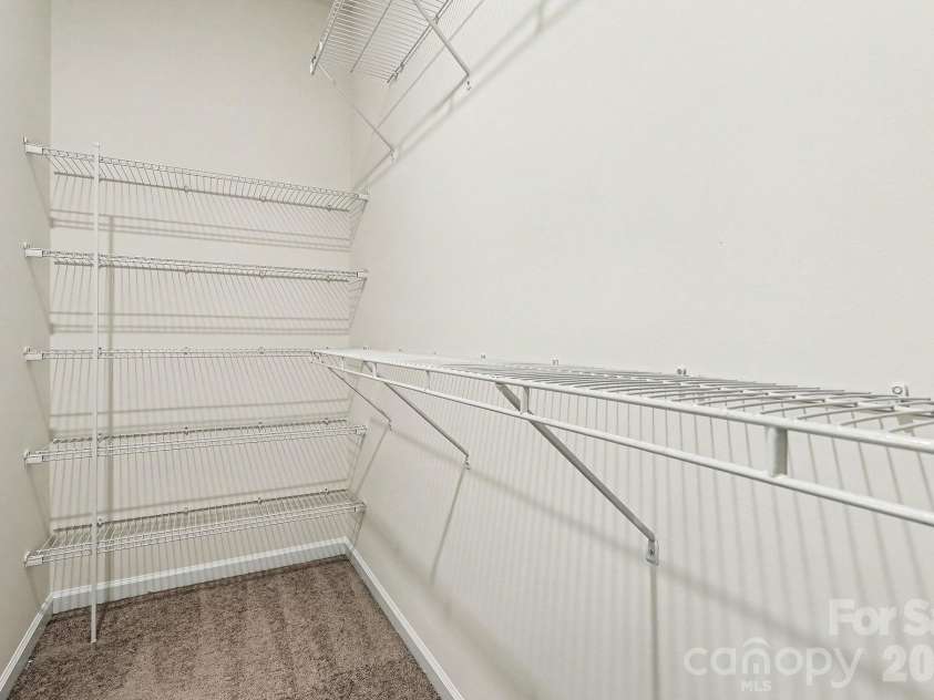 6056 Cloverdale Drive, Tega Cay, SC 29708.  MLS# CAR4337885, YatesRealty ID 8573. Primary suite features a large walk-in closet