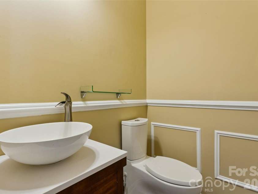 9509 Gilead Grove Road, Huntersville, NC 28078.  MLS# CAR4401597, YatesRealty ID 8574. Downstairs Half Bath with upgraded vanity/sink, Wainscoting