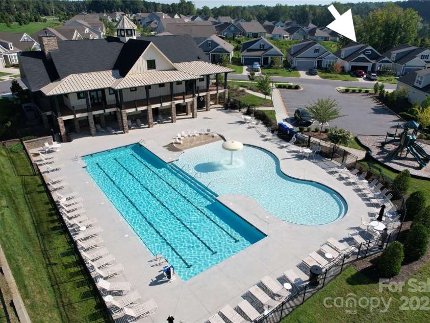 4023 Gozzi Drive, Iron Station, NC 28080.  MLS# CAR4223127, YatesRealty ID 8588. Back side view of the clubhouse - the home is just across the street.