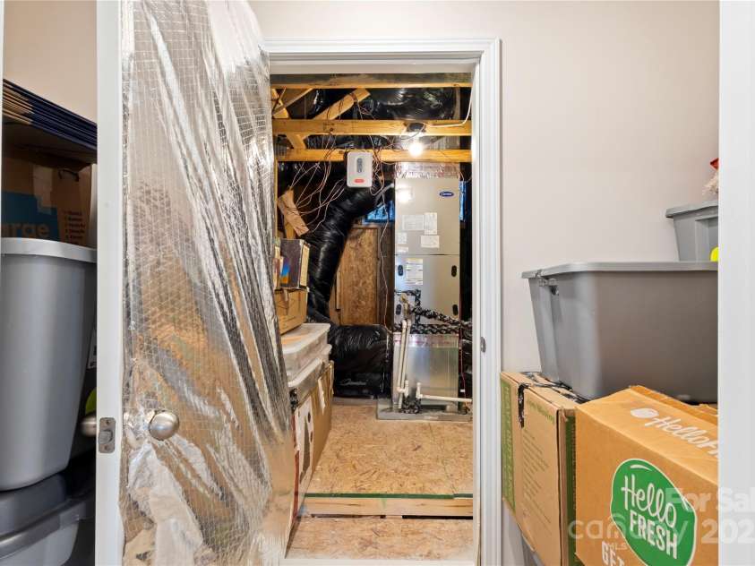 4023 Gozzi Drive, Iron Station, NC 28080.  MLS# CAR4223127, YatesRealty ID 8588. Entry to utility room upstairs