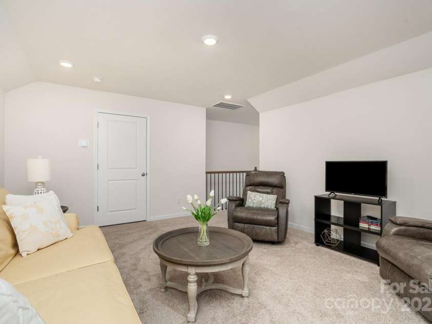 4023 Gozzi Drive, Iron Station, NC 28080.  MLS# CAR4223127, YatesRealty ID 8588. Large walk-in closet has 2nd door leading to walk-in attic storage