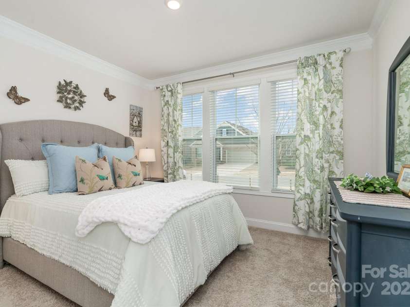 4023 Gozzi Drive, Iron Station, NC 28080.  MLS# CAR4223127, YatesRealty ID 8588. Main floor guest room is at the front of the home and measures 12'1