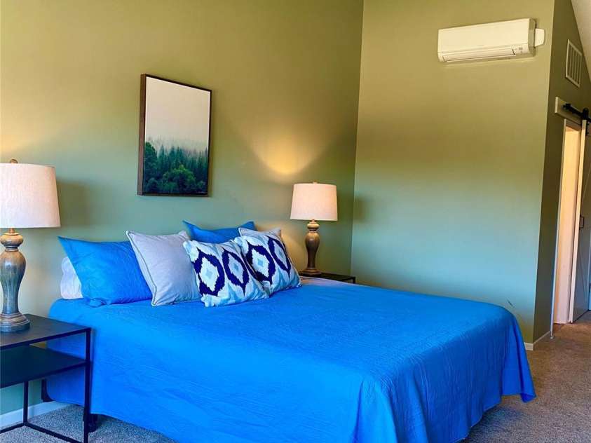 135 Fox Run Boulevard, Lake Lure, NC 28746.  MLS# CAR4226040, YatesRealty ID 8591. Bedroom has en-suite and deck off the front looking at the mountains