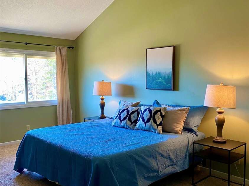 135 Fox Run Boulevard, Lake Lure, NC 28746.  MLS# CAR4226040, YatesRealty ID 8591. Second large upstairs bedroom with king bed