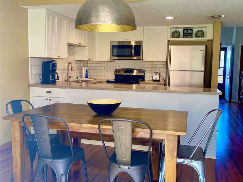 135 Fox Run Boulevard, Lake Lure, NC 28746.  MLS# CAR4226040, YatesRealty ID 8591. Updated kitchen with open to dining room and back porch