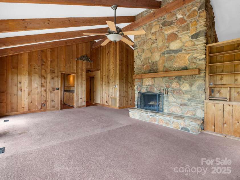 177 Fowler Road, Mill Spring, NC 28756.  MLS# CAR4249050, YatesRealty ID 8594. Living room in 2nd living quarters looking towards the kitchen.