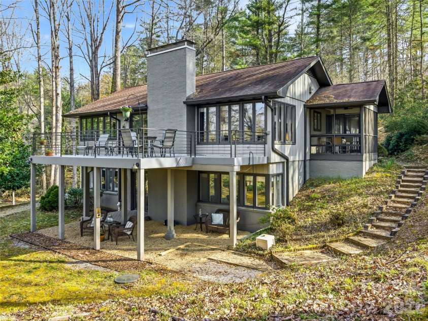 1663 Glen Cannon Drive, Pisgah Forest, NC 28768.  MLS# CAR4360685, YatesRealty ID 8596. Walls of windows